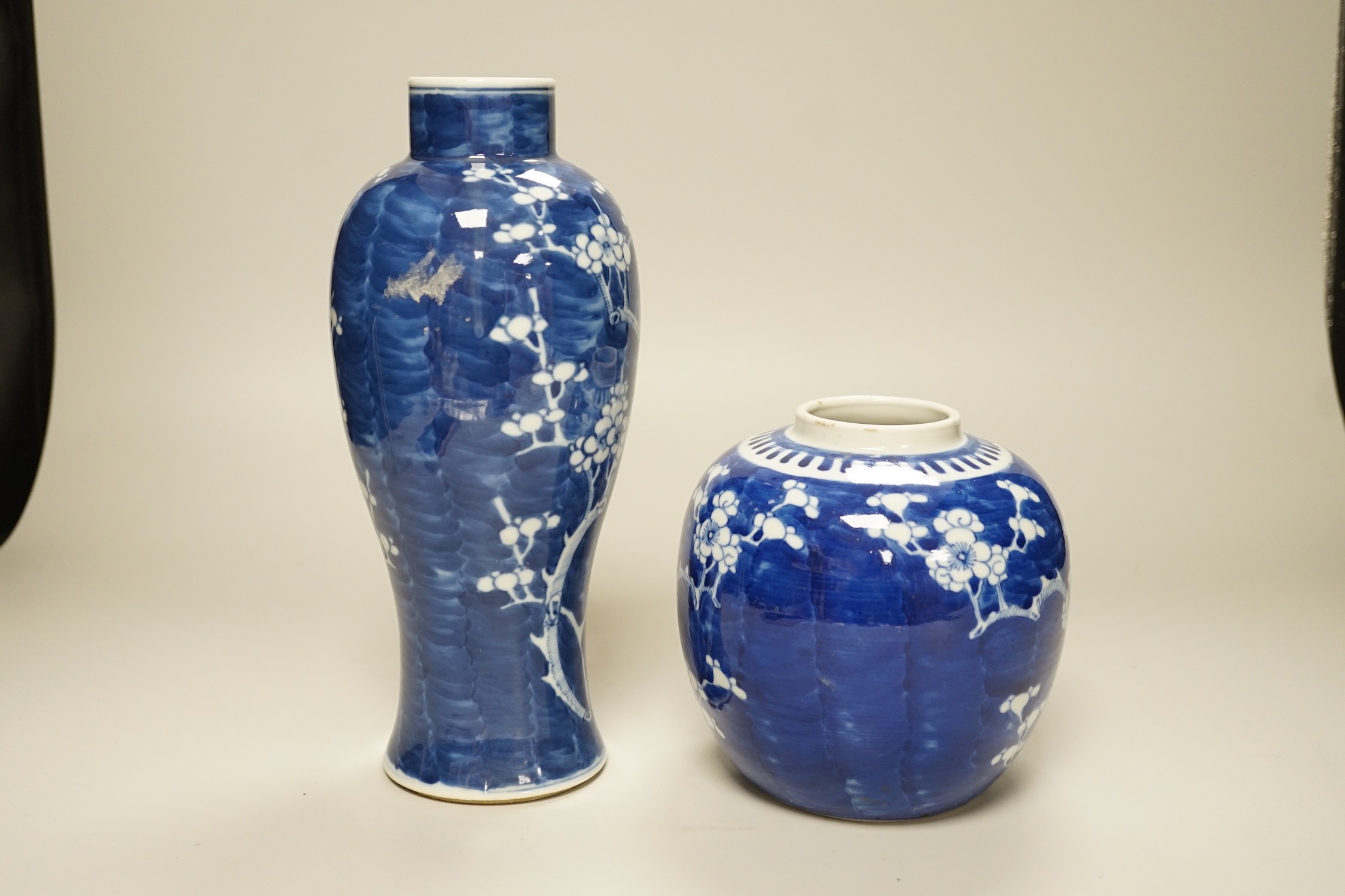 A Chinese blue and white prunus vase and a similar jar, late 19th century, vase 13.5cms high